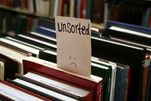 Picture of books disorganized on a shelf